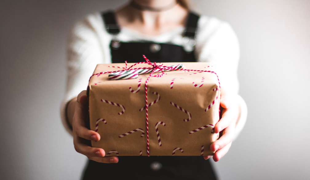 Woman holding a wrapped gift