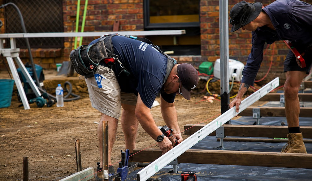 Carpenters Aligning a Wooden Deck Frame