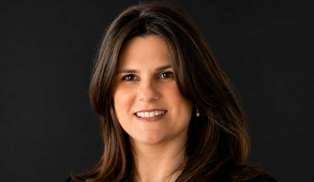 Dr. Anna Kiaos' Dark Studio Headshot
