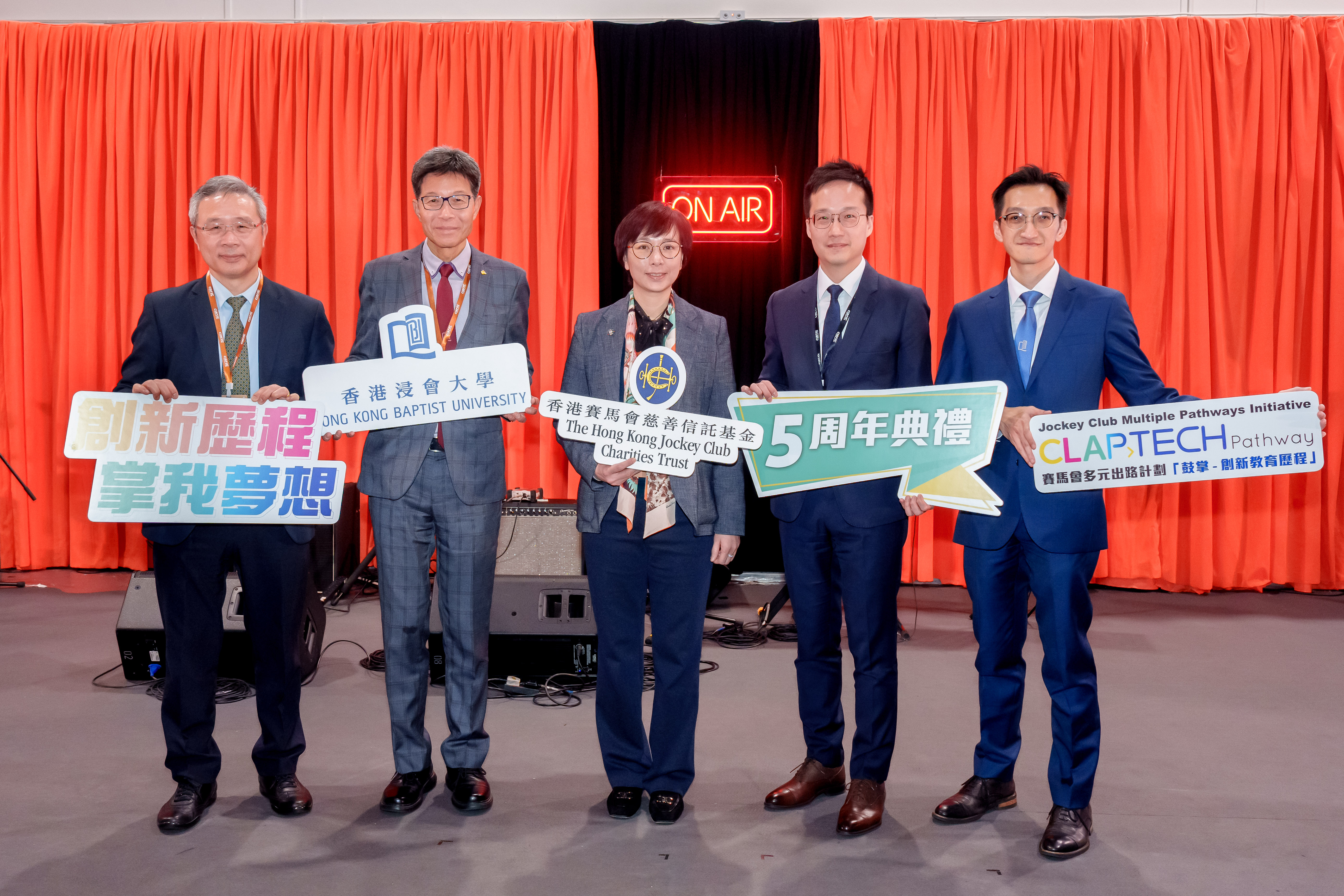 (From left to right) Prof. Ronald Chung, Dean of the School of Continuing Education, Hong Kong Baptist University; Dr Albert Chau, Vice-President (Teaching and Learning), Hong Kong Baptist University; Ms. Winnie Ying, Head of Charities (Youth Development & Poverty Alleviation) at The Hong Kong Jockey Club; Mr. Kasper Ng, Principal Assistant Secretary (Further Education) at the Education Bureau; and Mr. Andrew Ho, Director of CLAP-TECH Centre celebrate the 5th anniversary of The Jockey Club Multiple Pathways Initiative – CLAP-TECH Pathway. This event highlights the successful tripartite collaboration of Hong Kong Baptist University, industry partners, and secondary schools to nurture “New Collar” talent in Hong Kong.