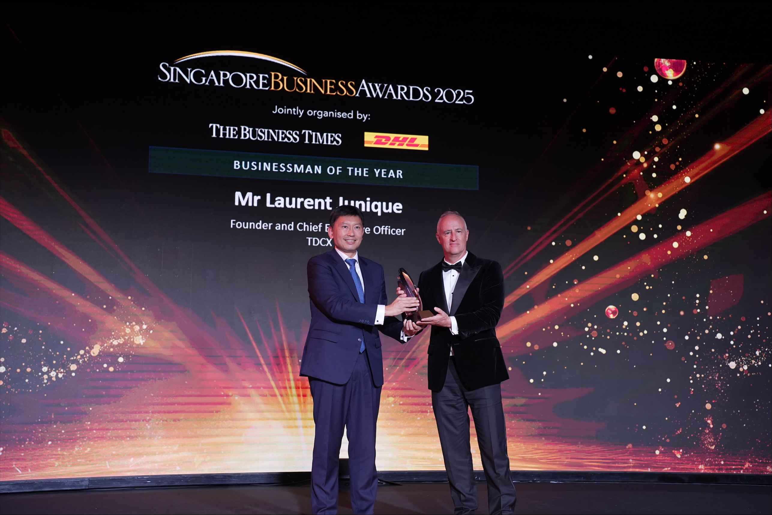 Mr Chee Hong Tat, Minister for Transport of Singapore, presenting the Businessman of the Year 2025 award to Mr Laurent Junique, Founder and CEO of TDCX held at Ritz Carlton, Millenia.